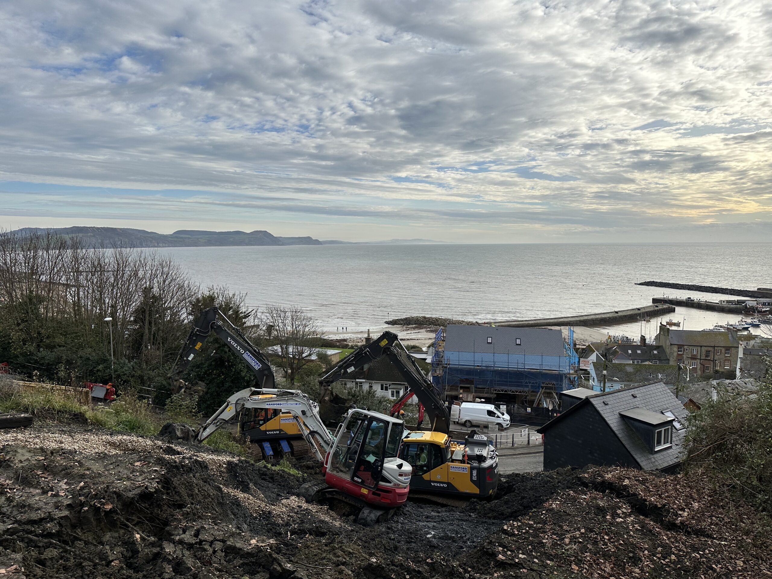 Hansford Construction excavators carrying out landslip stabilisation and slope reinforcement on Cobb Road, Lyme Regis